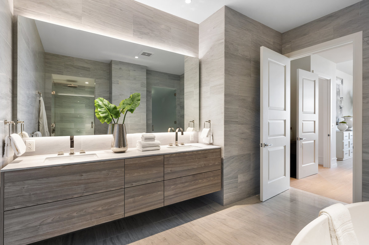 Primary suite stone-clad bath with dual sinks