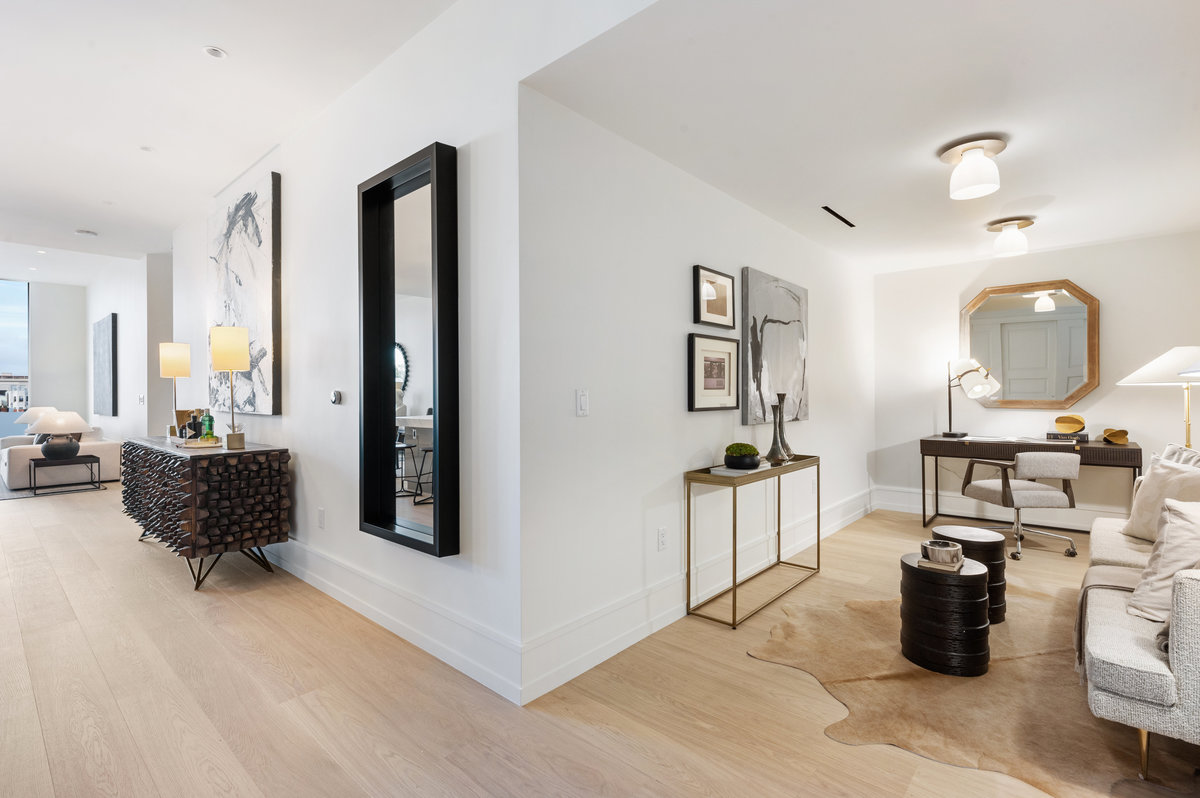 Entry with great room ahead on the left and den on right