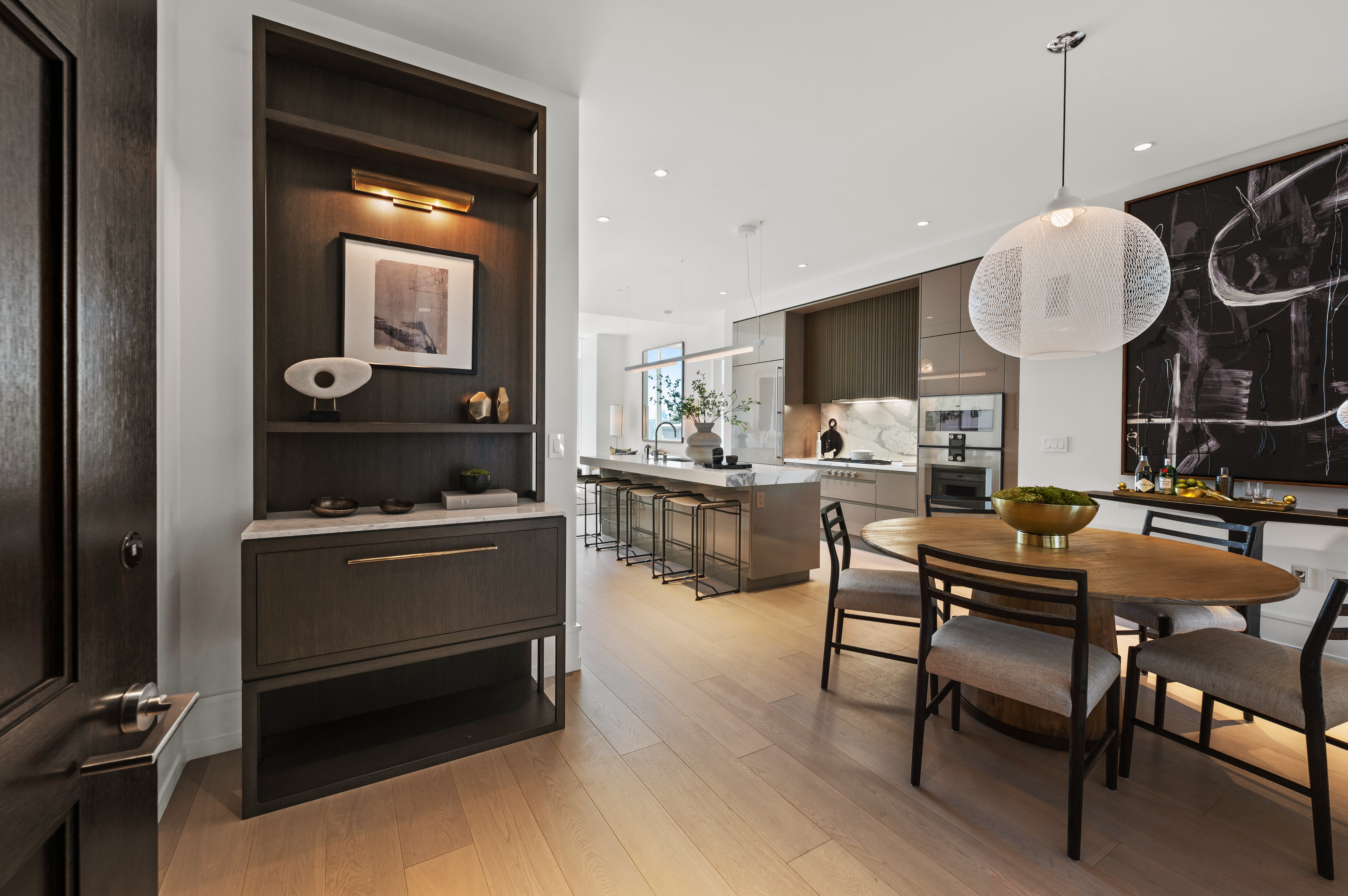 Entry to Residence 503, with dining-kitchen-living open plan great room