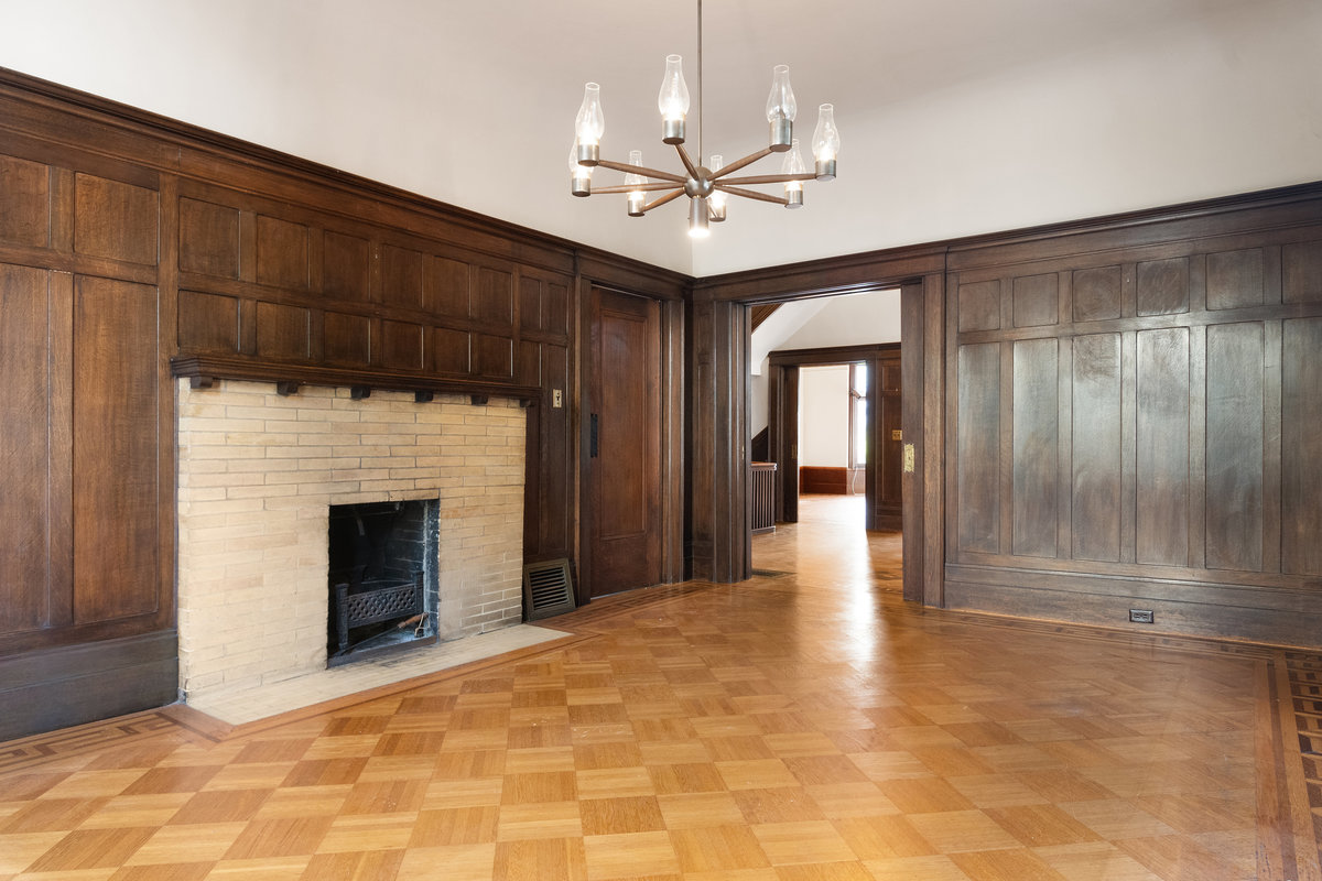 Dining room, fireplace, with foyer & living room beyond