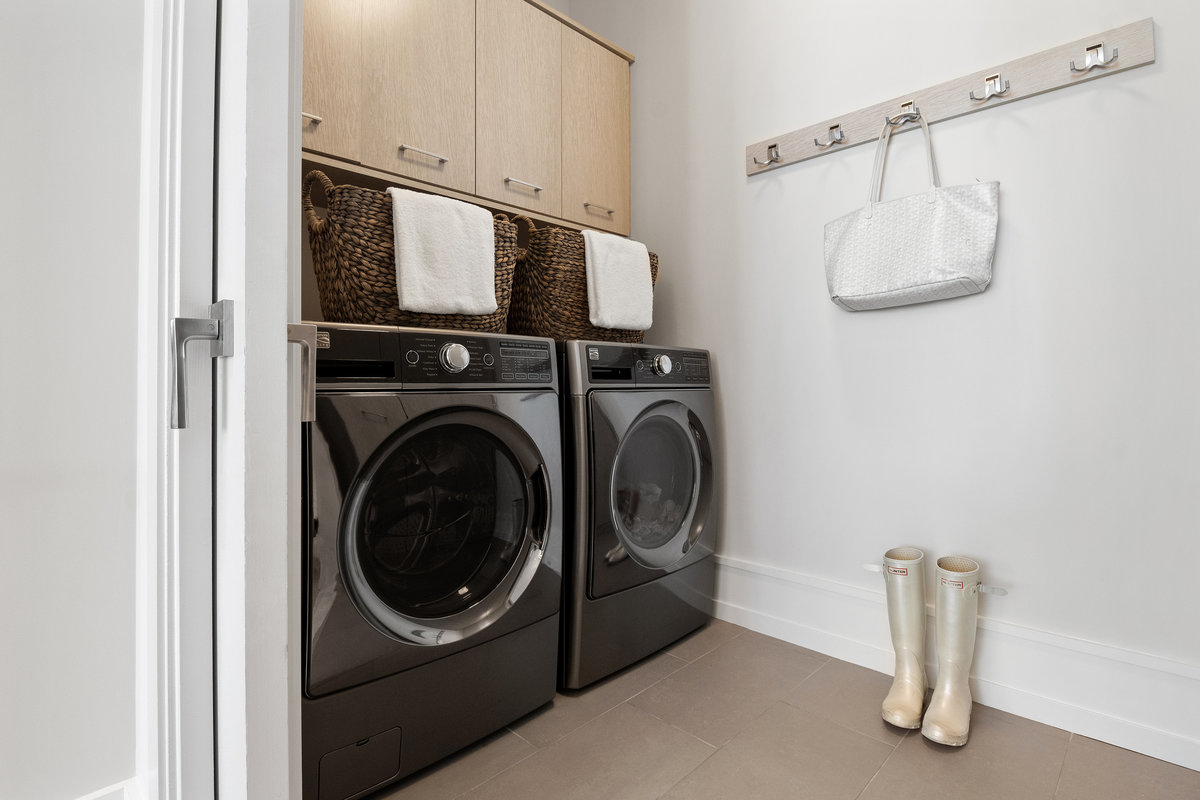 Laundry room off kitchen; not shown is other side of this room with wall of pantry closets