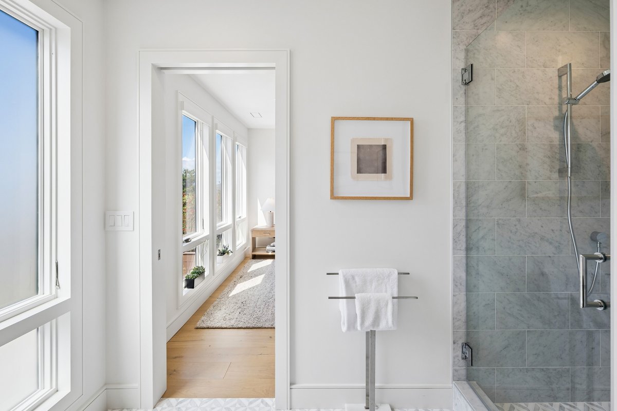 Looking into the west bedroom from its marble bath