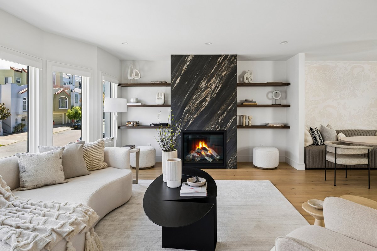 Gas fireplace framed by floating shelves